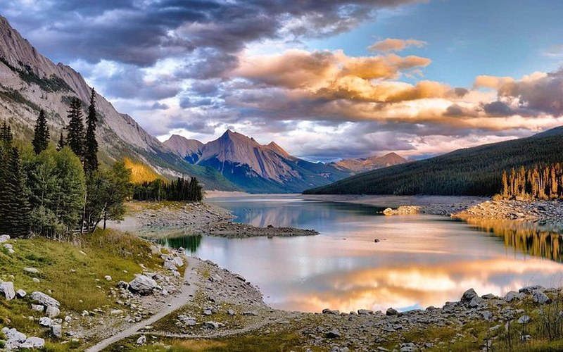 A mountain lake under evening clouds in Jasper National Park